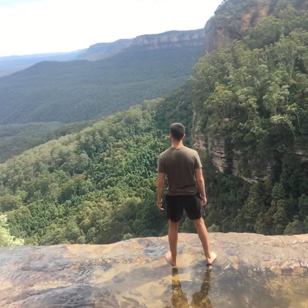 Student looking out at mountain landscape