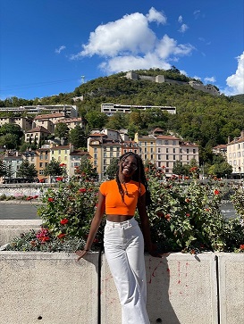 Girl stood in front of building