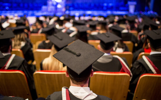 Graduates at a graduation ceremony