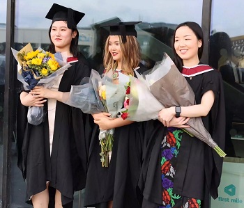 graduates walking to the arena