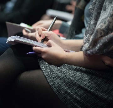 Image of people taking notes