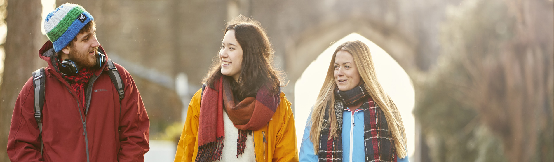 Three students walking through Singleton Park