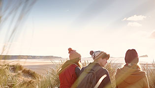 Students sat on the beach