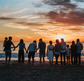 Family on a beach at sunset