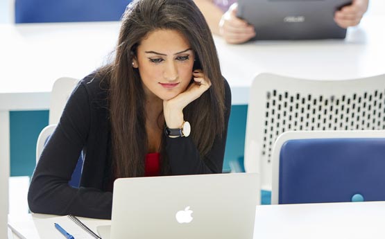 Woman looking at her laptop