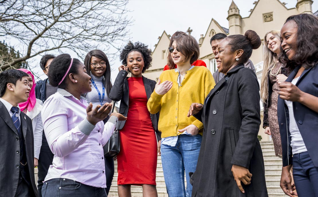 a group of happy postgraduate students