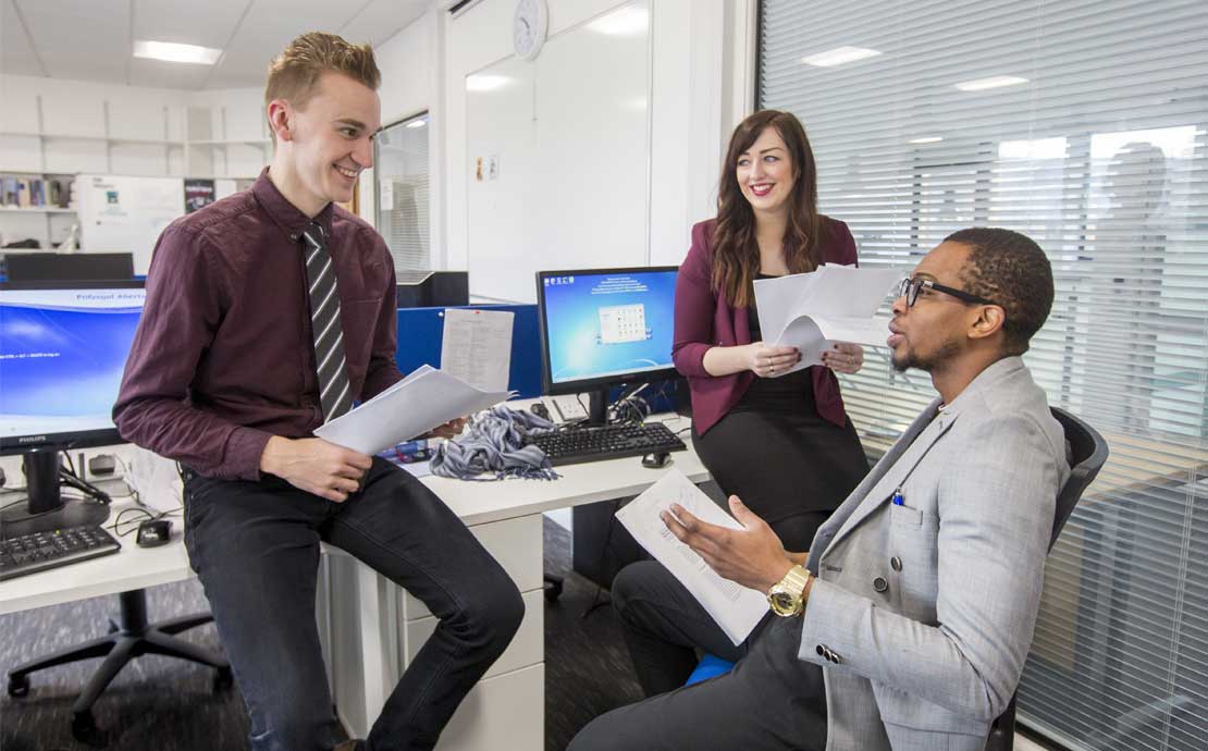 image of research students chatting and laughing