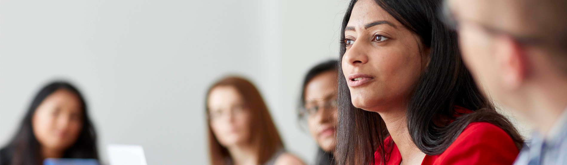 A group of people in a meeting