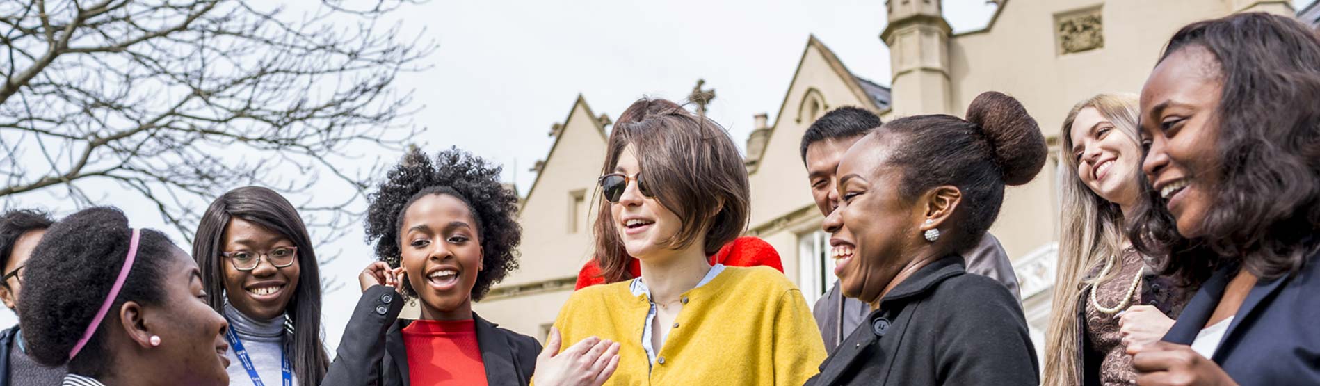 a group of students smiling and laughing