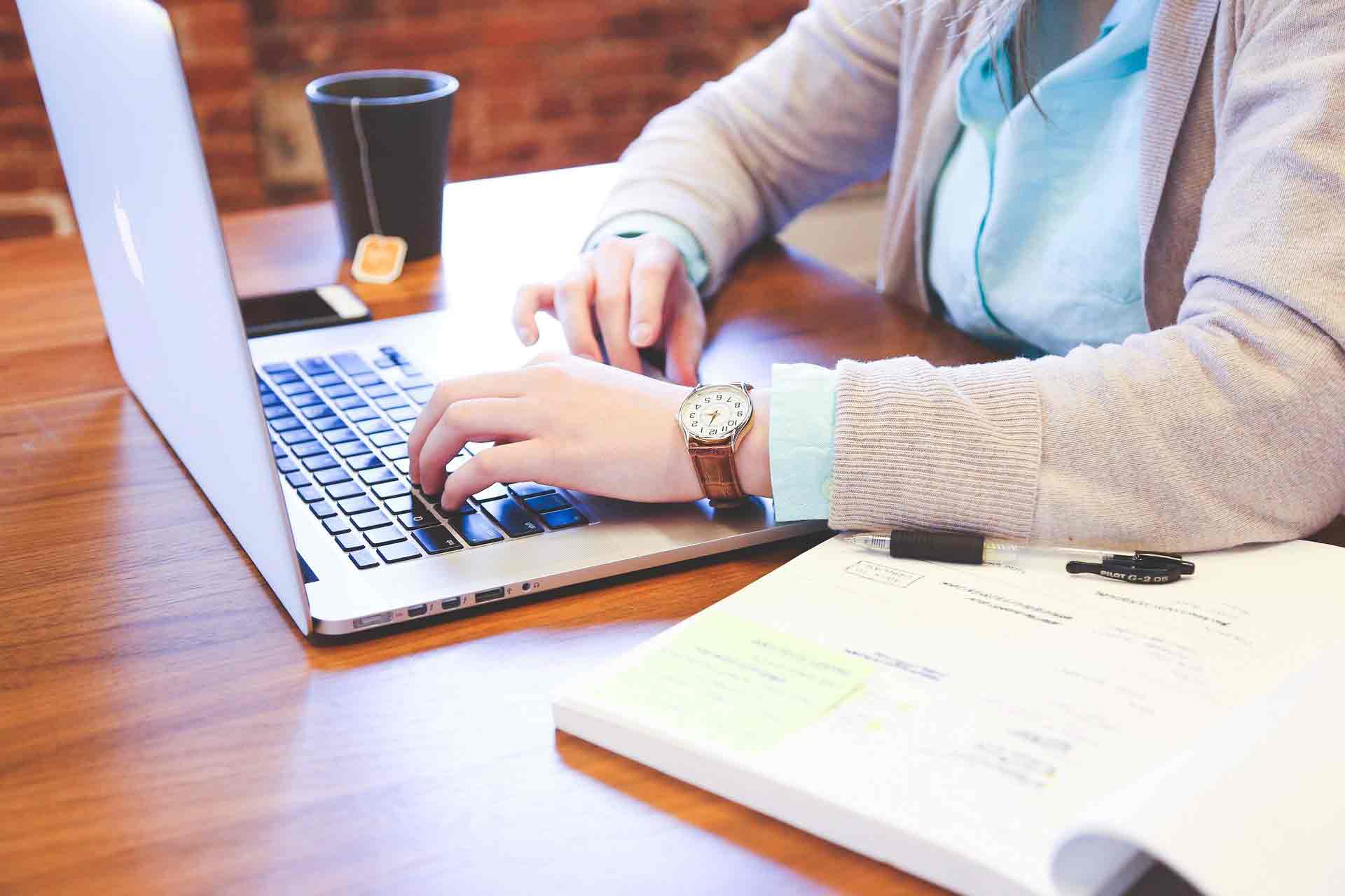 a student working at a laptop