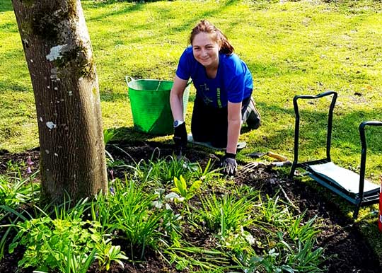 A female volunteer planting