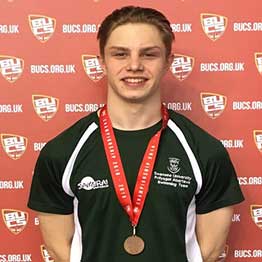 Sport Swansea Scholar Lewis Fraser wearing medal