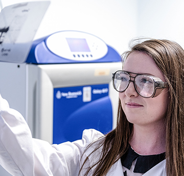 Student looking at results on acetate