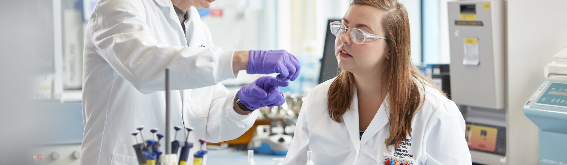 Student and Lecturer in a lab 