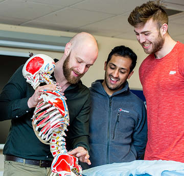 students with osteopathy lecturer