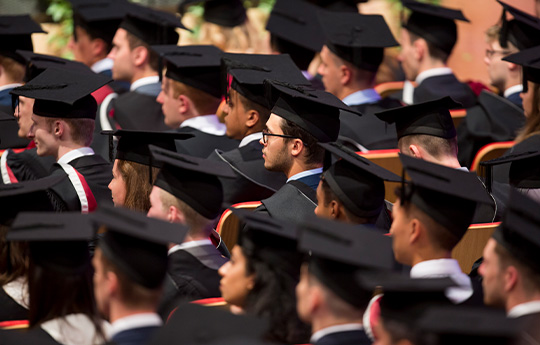 Students in cap and gown for graduation