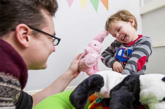 Student interacting with child