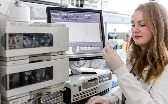 Researcher looking at sample