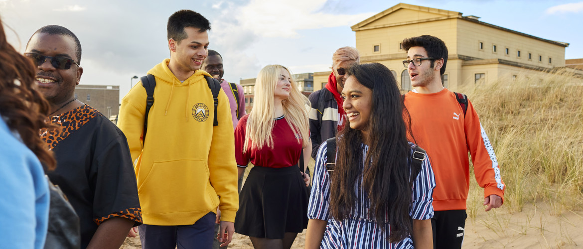 students walking on beach