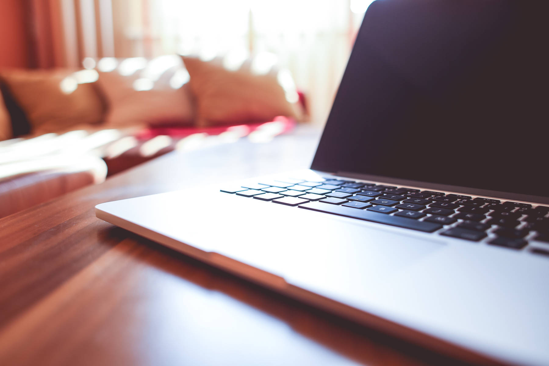 A close up of a laptop computer on a desk. 