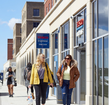 female student outside mall bay campus