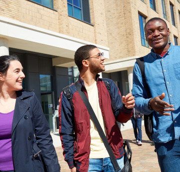 students walking bay campus