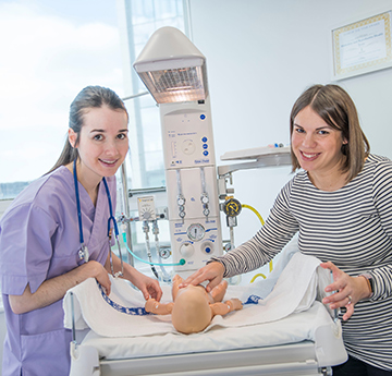 Student Midwife and Lecturer with model baby