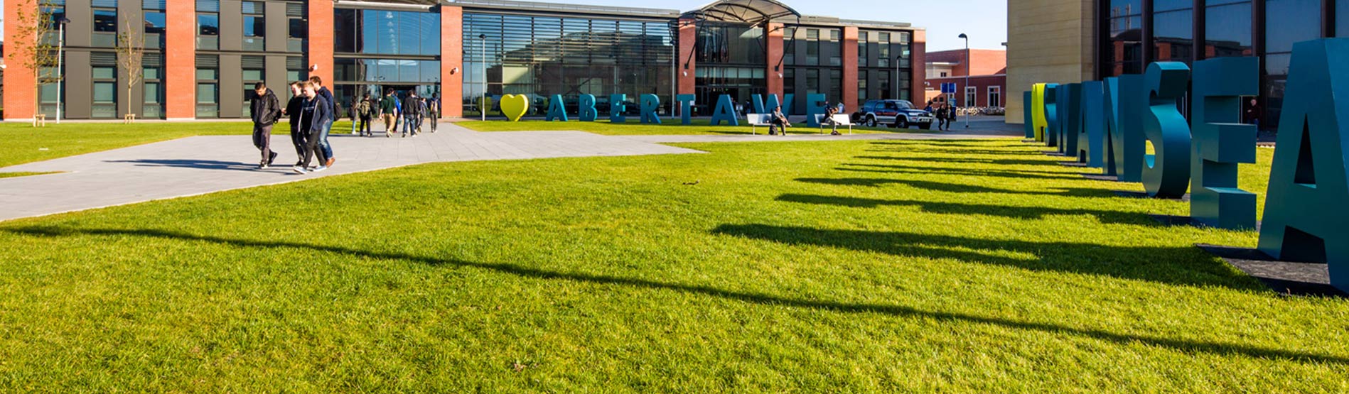 Students walking through Bay Campus, Swansea University on an Open Day