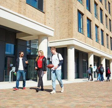 Students walking through bay campus