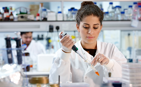 Female student Carrying out experiment 