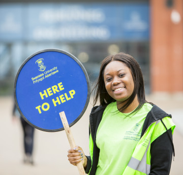 student helping on open day