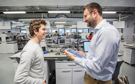 male student with male lecturer in Engineering.