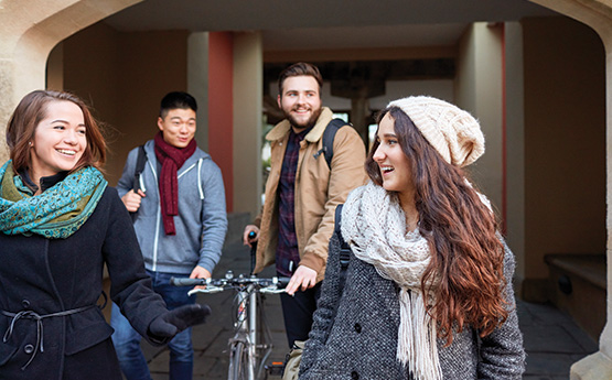 Students walking through the archway