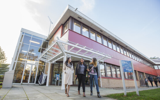 Staff walking outside Haldane