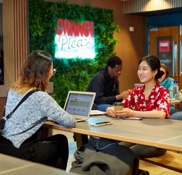 Two female students chatting 