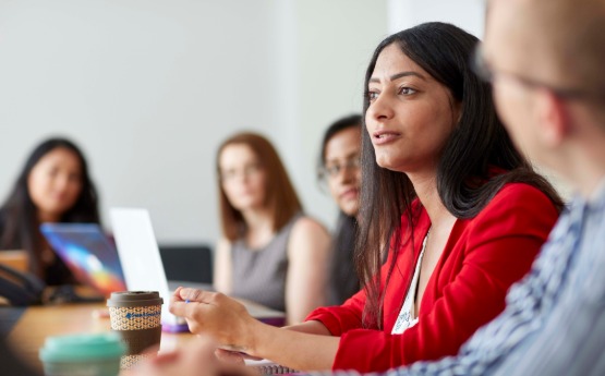 Woman sitting in a meeting