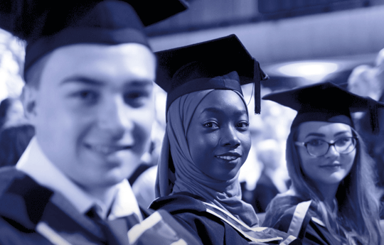 Students in their cap and gowns at Graduation