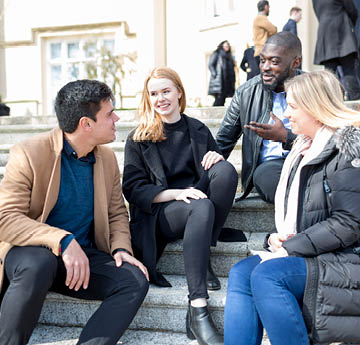 students sitting on steps