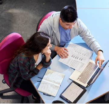 students working on a laptop