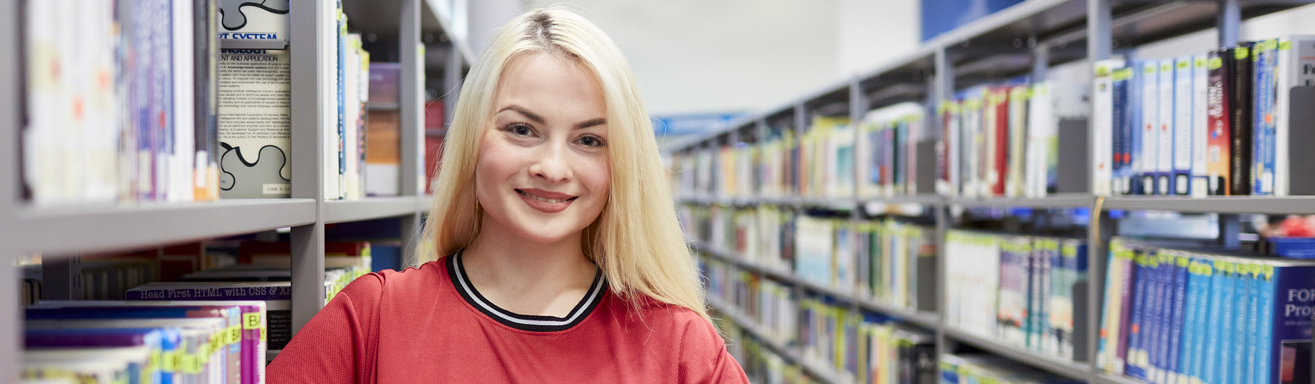 Student stood in library 