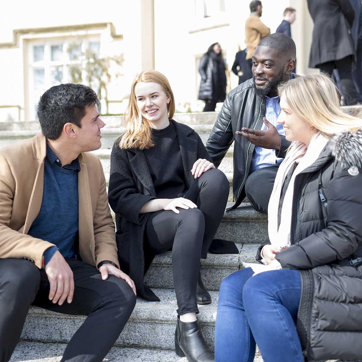 students sitting on steps