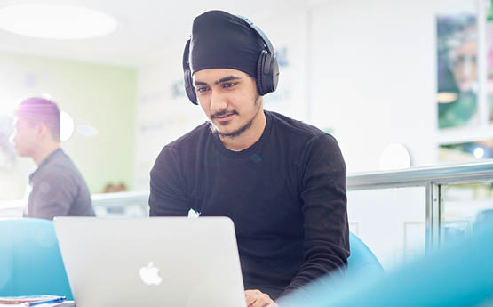 student working on a laptop