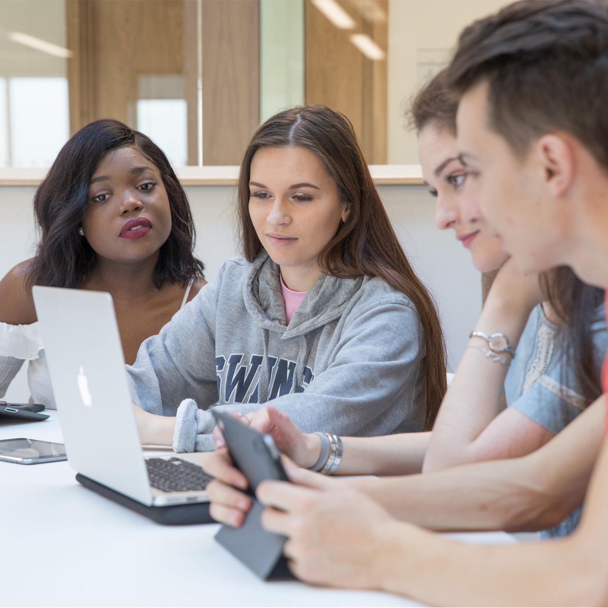 students working together on laptop