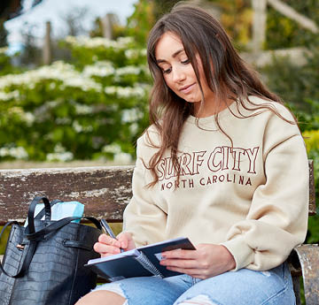 student sitting on a bench