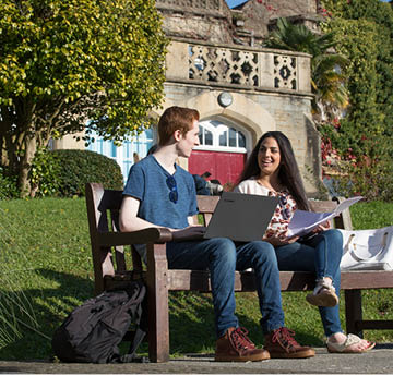 students sitting on a bench