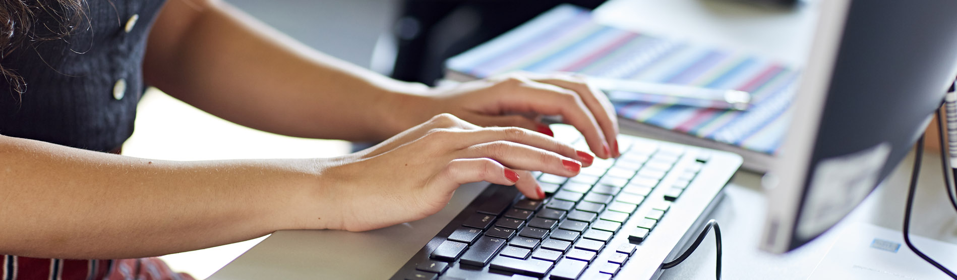 Students typing on keyboard 