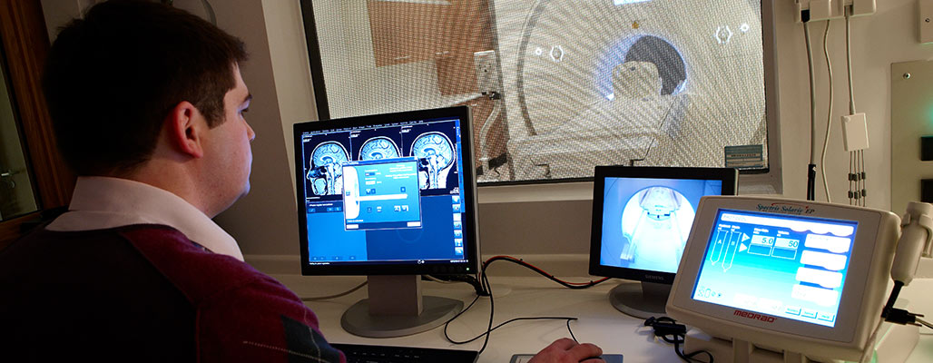 Student ooking at a CT Scanner