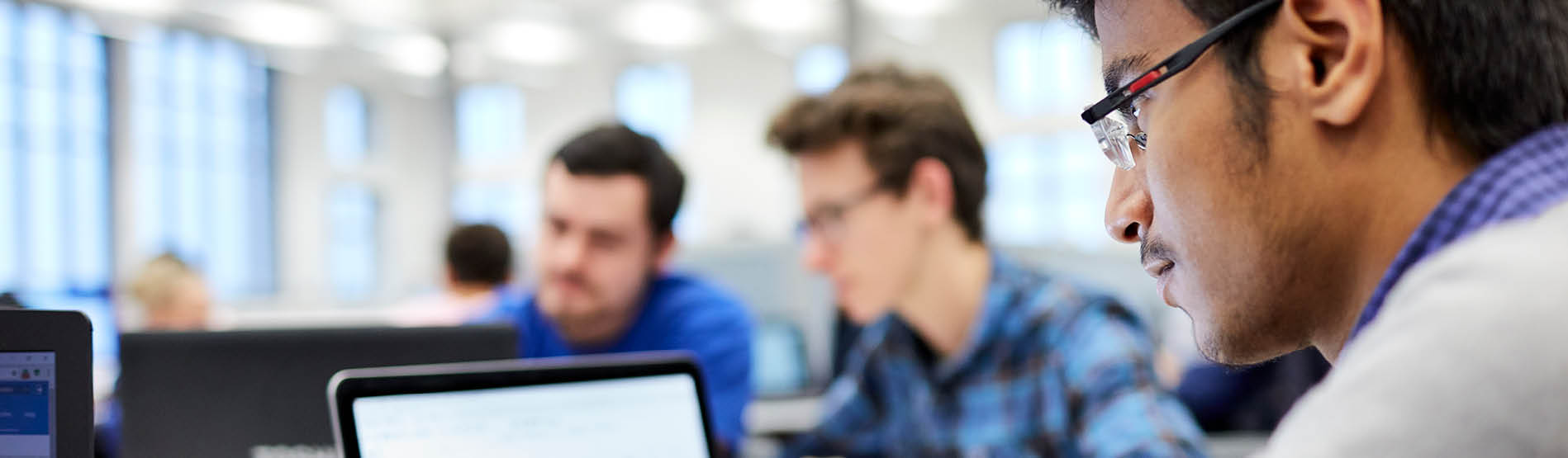 students working on a laptop