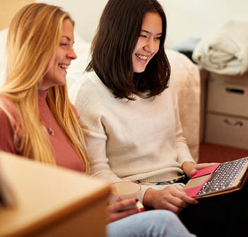 students looking at a laptop