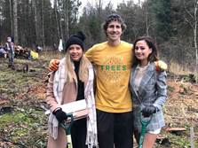 Tree planting organiser Jean-Louis Button (centre) with two of the students helping to plant 800 trees on Kilvey Hill